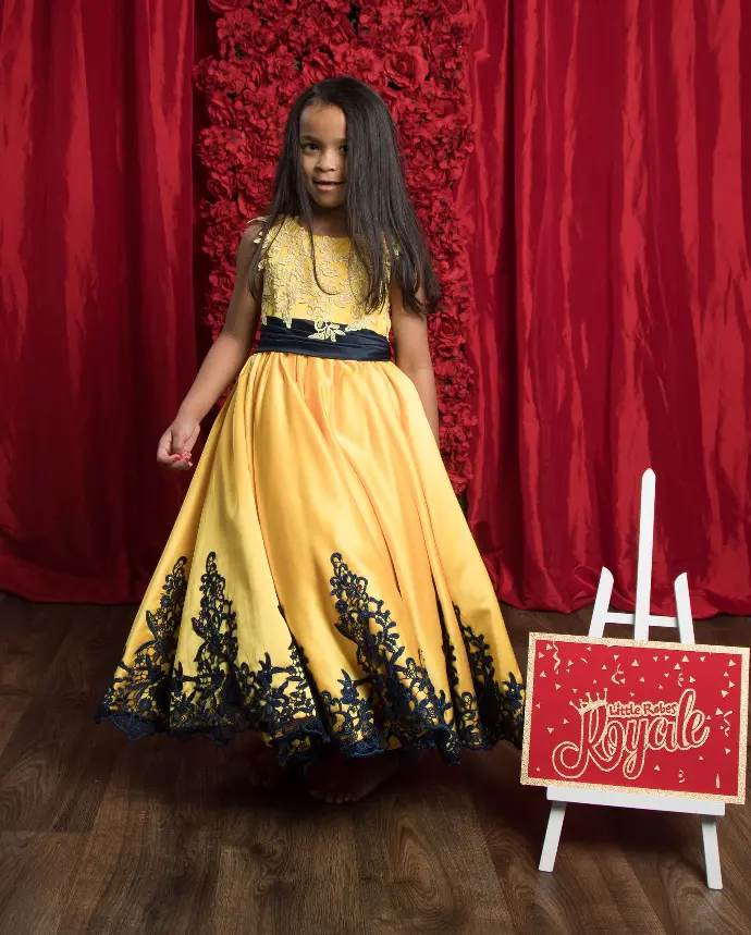 Sleeveless Lace applique princess ball gown with satin belt and scoop neckline
