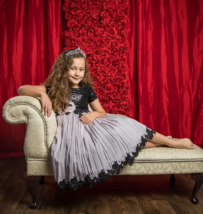 Short sleeve sequin knee-length dress with lace applique trim on georgette skirt