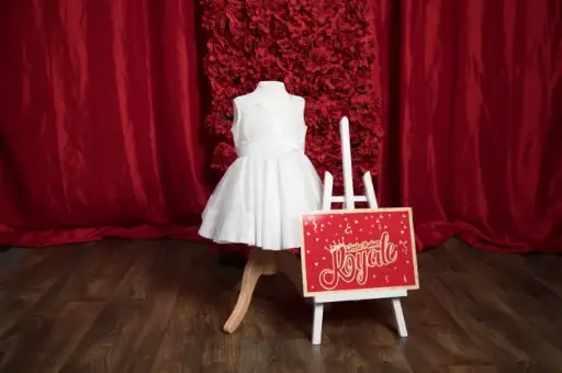 Sleeveless satin petite baby dress with soft sequin trim and top